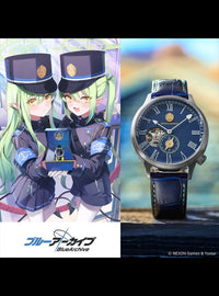 A luxury watch with a dark blue leather strap and a blue skeleton dial, displayed next to an anime illustration of two characters in military uniforms holding a matching blue box. The BlueArchive logo is visible at the bottom.