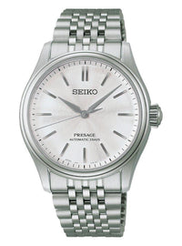 A Seiko Presage automatic watch with a silver stainless steel case and link bracelet, featuring a textured silver dial with simple stick indices.