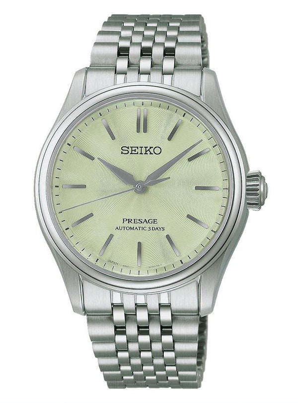 A Seiko Presage automatic watch with a silver stainless steel case and link bracelet, featuring a pale yellow dial with silver-tone baton indices.