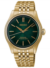 A Seiko Presage automatic watch with a gold-tone metal case and bracelet, featuring a textured dark green dial with gold-tone indices and hands.