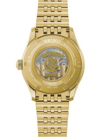 Gold-tone Seiko Sunburst watch with a transparent case back showing the mechanical movement and gold-tone internal details, set against a plain white background.