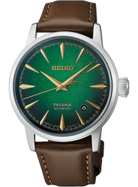 A Seiko Presage Automatic watch featuring a green dial with gold-tone baton hour markers and hands, housed in a silver-tone case with a brown leather strap.