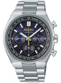 A Seiko Astron chronograph watch with a silver stainless steel case and link bracelet, featuring a dark blue and purple striped dial with gold accents.