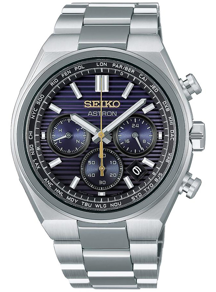 A Seiko Astron chronograph watch with a silver stainless steel case and link bracelet, featuring a dark blue and purple striped dial with gold accents.