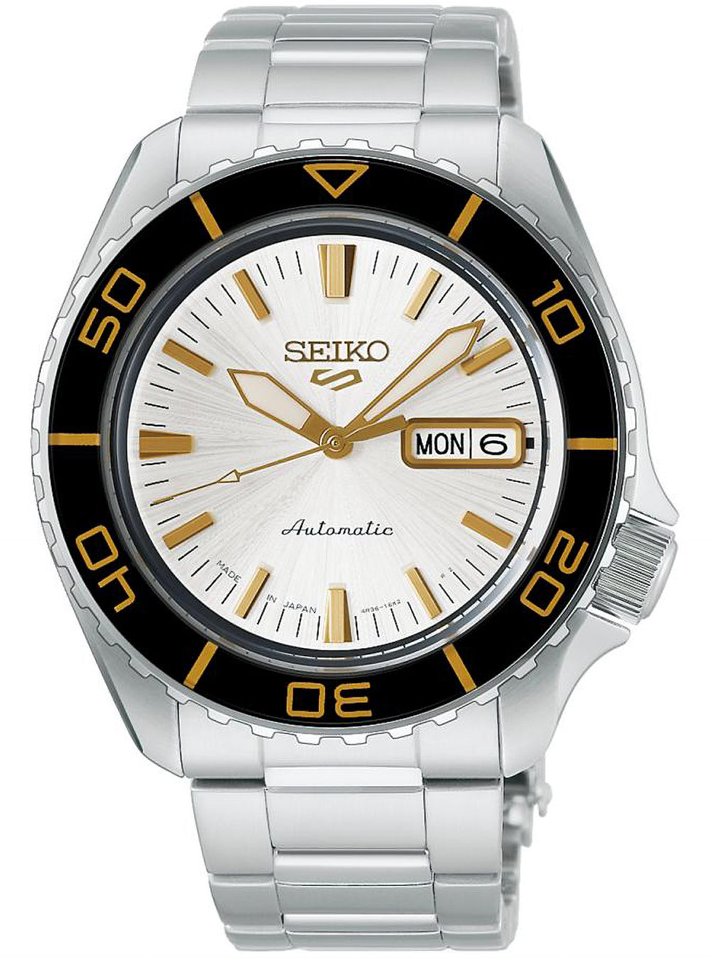 The dial features a bright, clean white finish with a delicate pattern radiating from the center. As it catches the light, its appearance shifts, adding depth to the understated design. Yellow-gold-tone indices, hour and minute hands, and the SEIKO logo create an elegant contrast against the white dial.