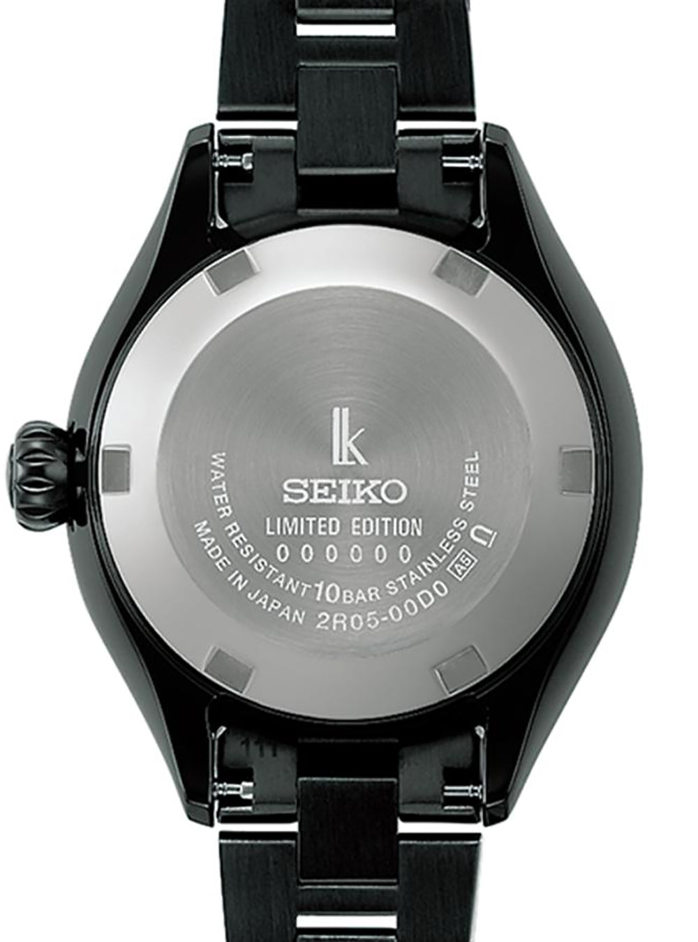 Close-up of the back of a Seiko watch with a black case and black metal link bracelet, showing a brushed silver case back with engraved text and logo.