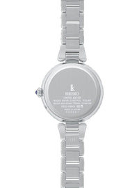 The back of a silver Seiko women's watch with a titanium link bracelet, featuring a round case with engraved details and a crown adjustment knob on a white background.