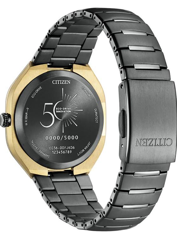 Citizen Eco-Drive Evolution watch with a gold-tone case, black dial, and dark gray metal link bracelet.